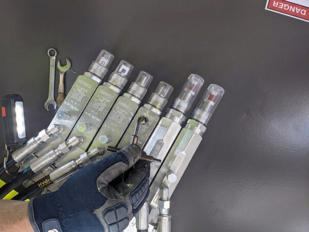 auto lube system troubleshooting done by a lube technician