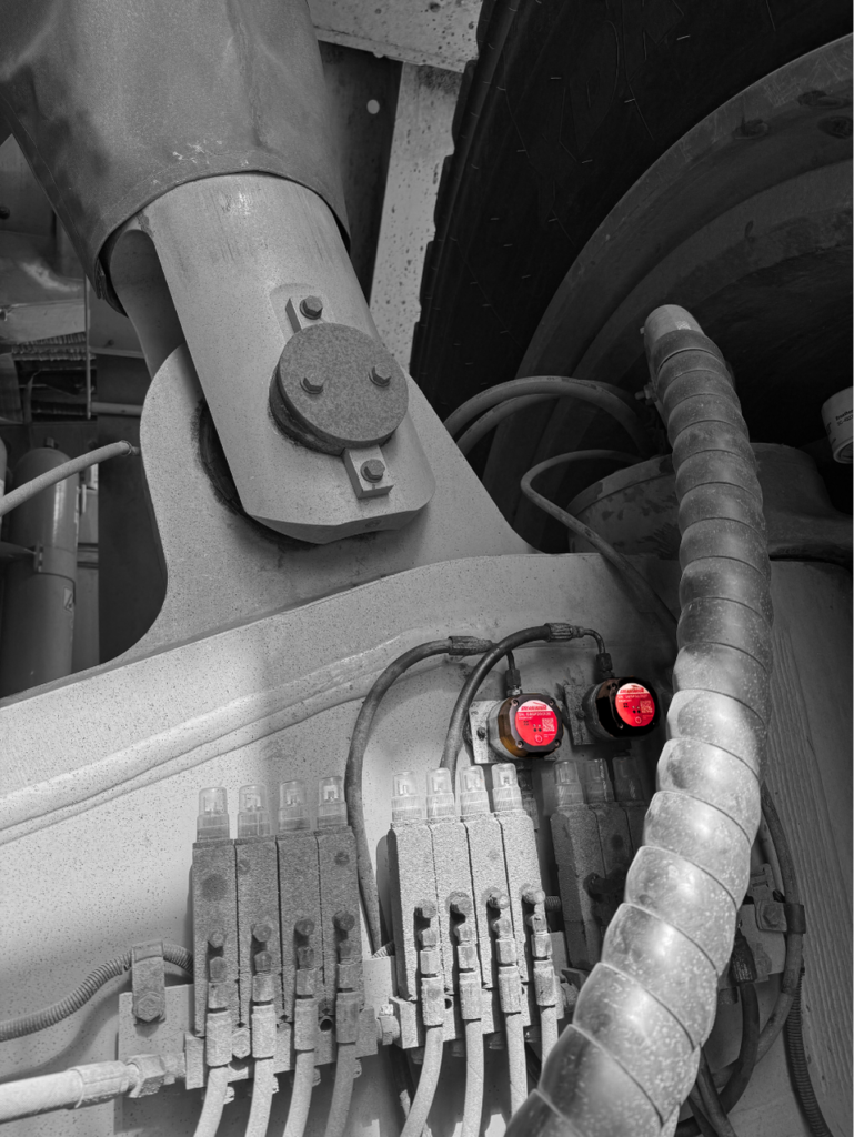 Mining haul truck monitored with GreaseBoss Critical Point Monitoring.